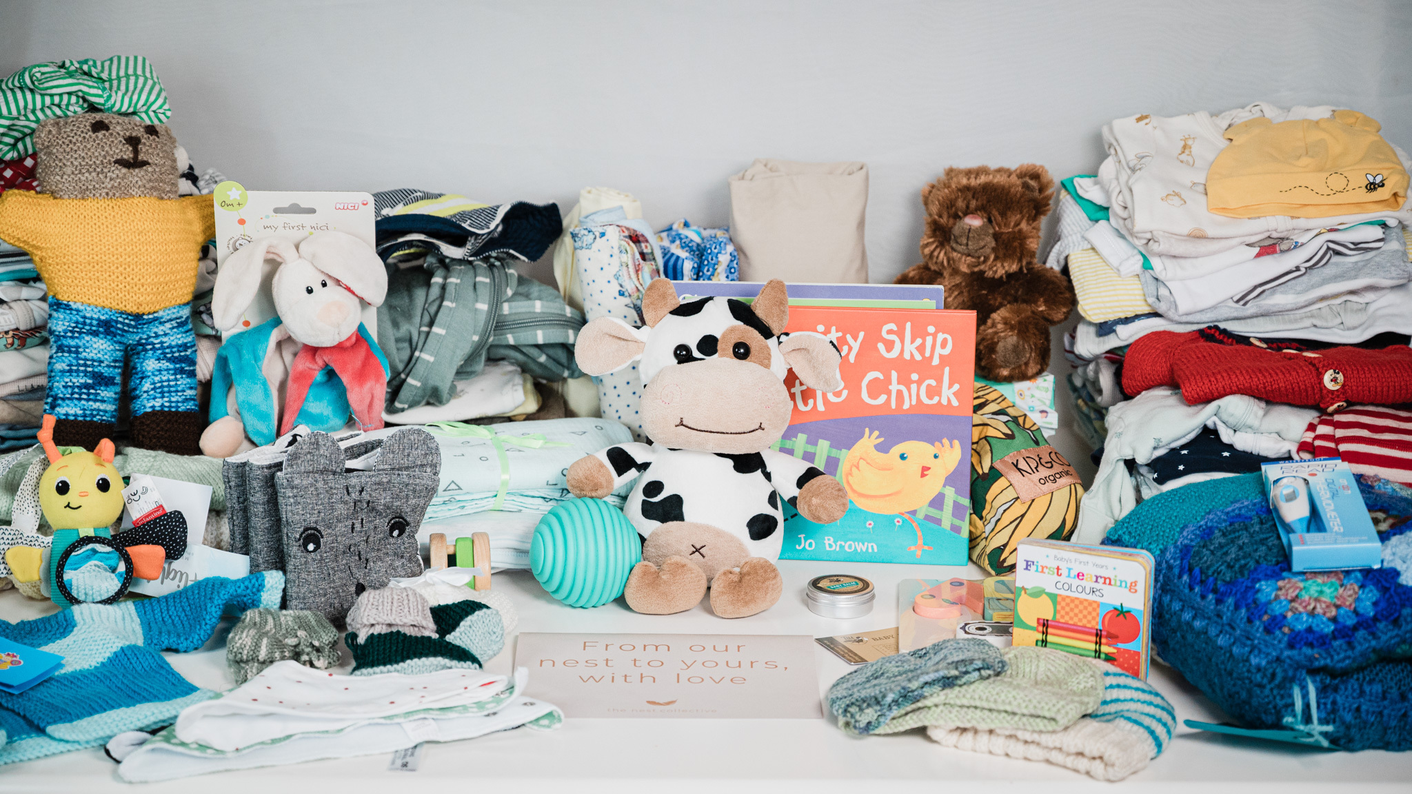 A pēpi pack of baby items with a card reading ‘From our nest to yours, with love’