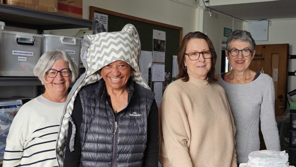 Volunteers with donated baby items
